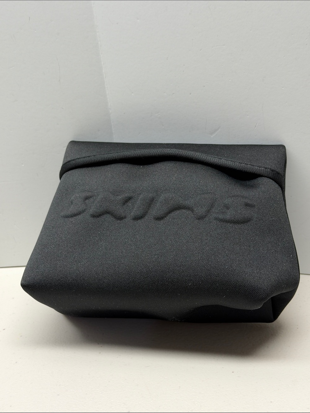SKIMS Black Embossed Neoprene Toiletry Pouch